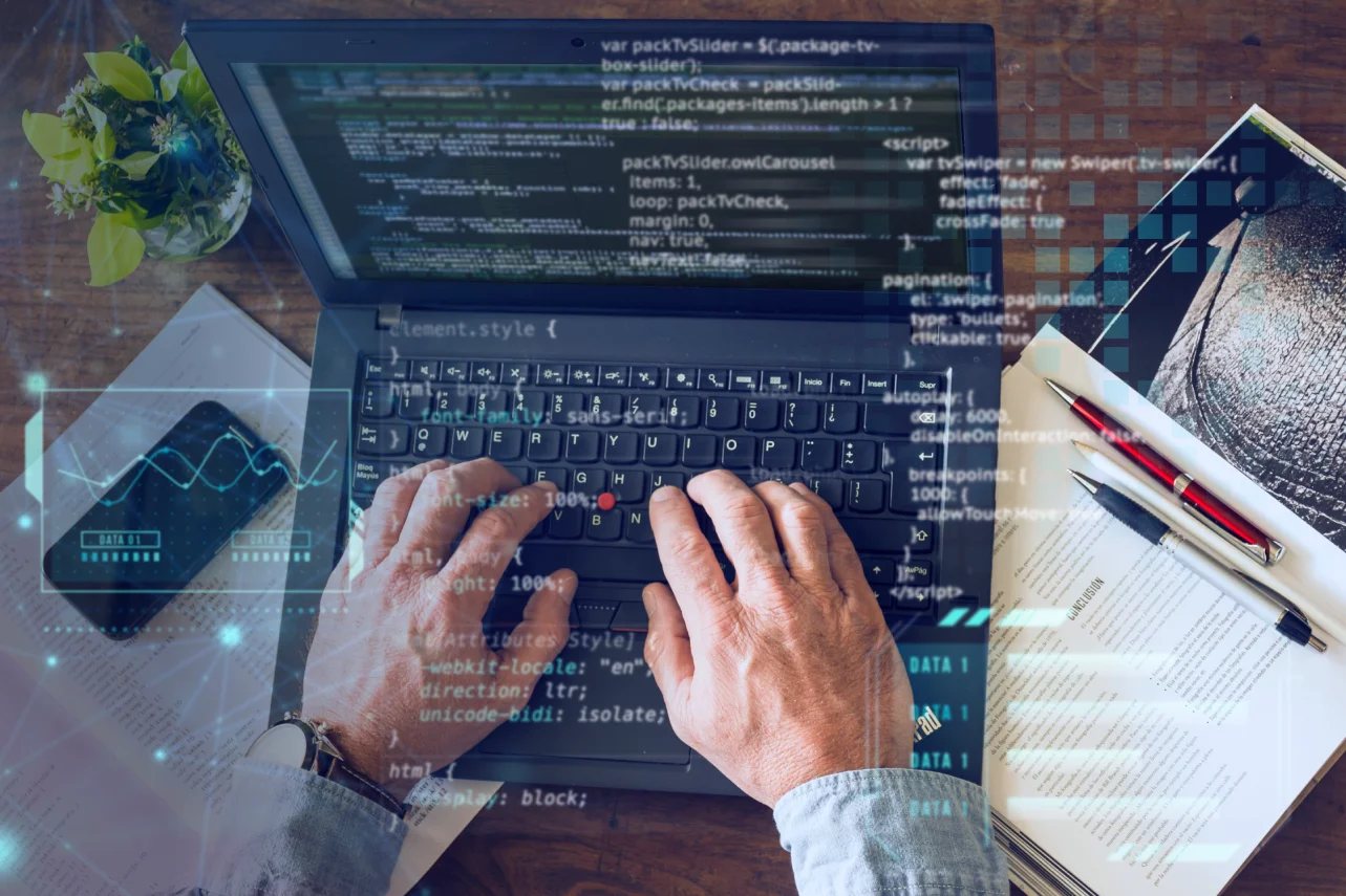 Web development workspace with programming code displayed on a laptop screen.