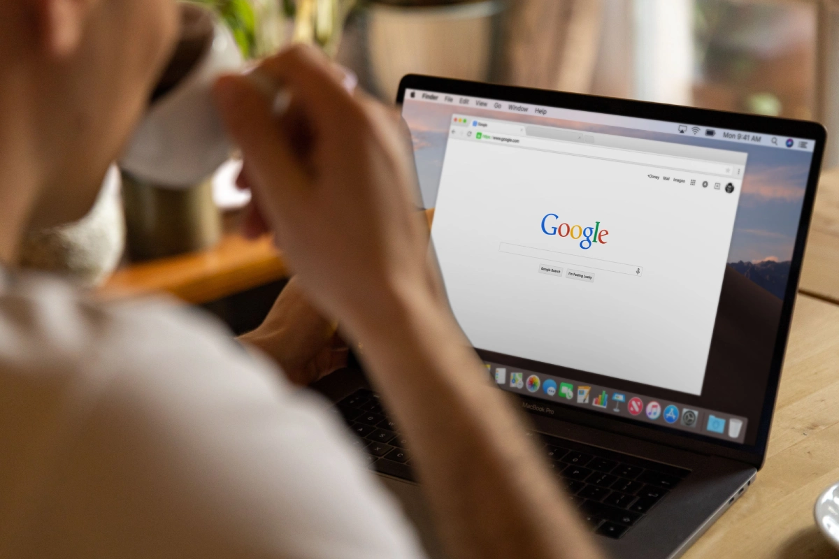 Person using Google Search on a laptop