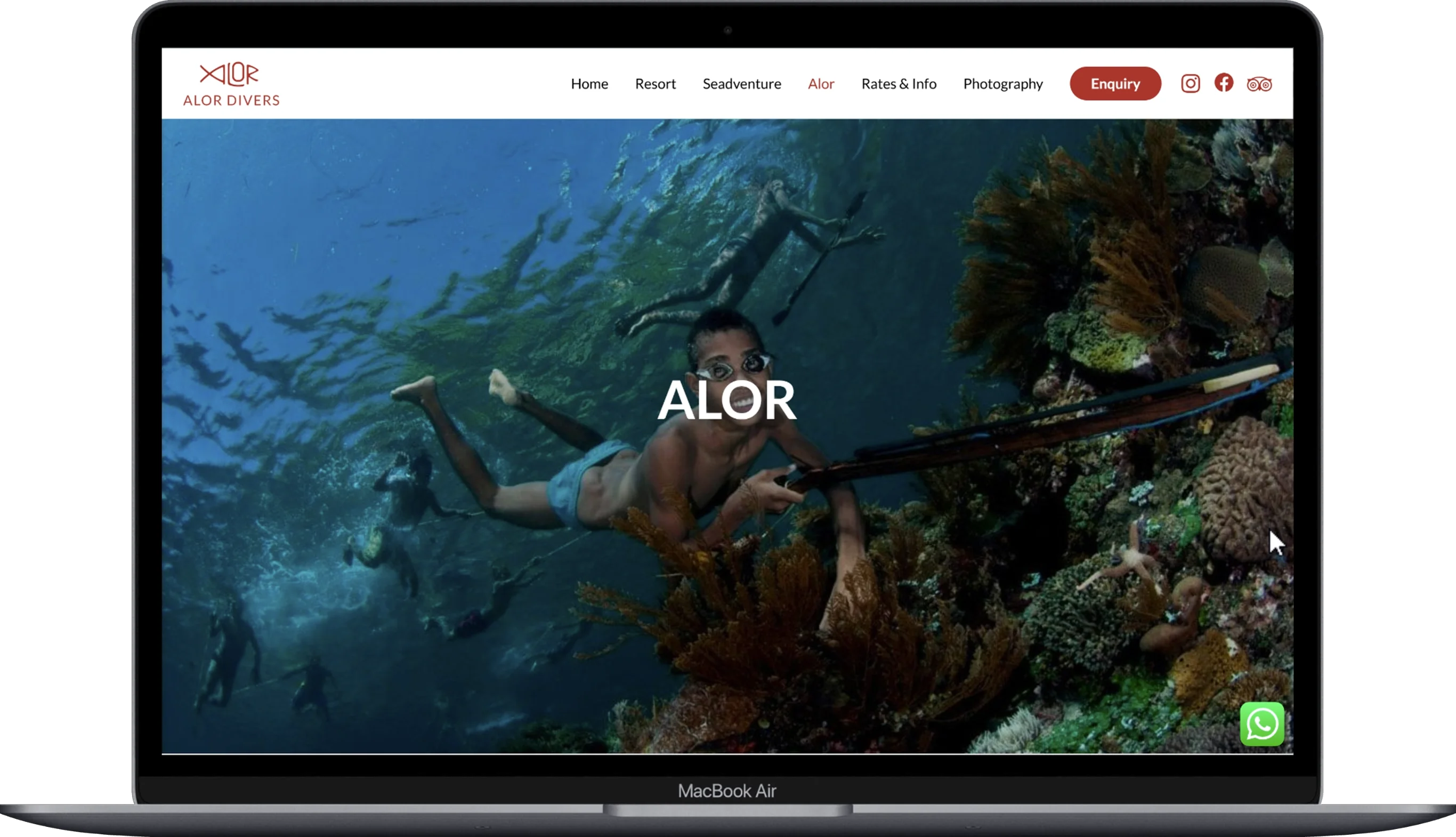 The page of the Alor Divers website displayed on a laptop.