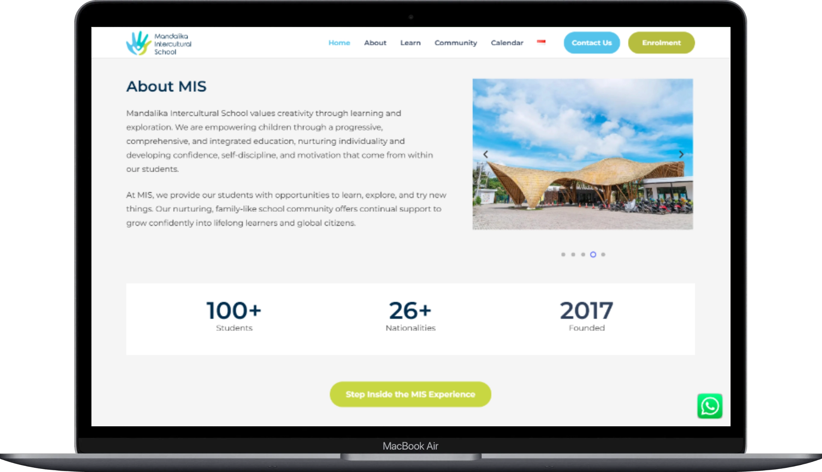 The page of the Mandalika Intercultural School website displayed on a laptop.