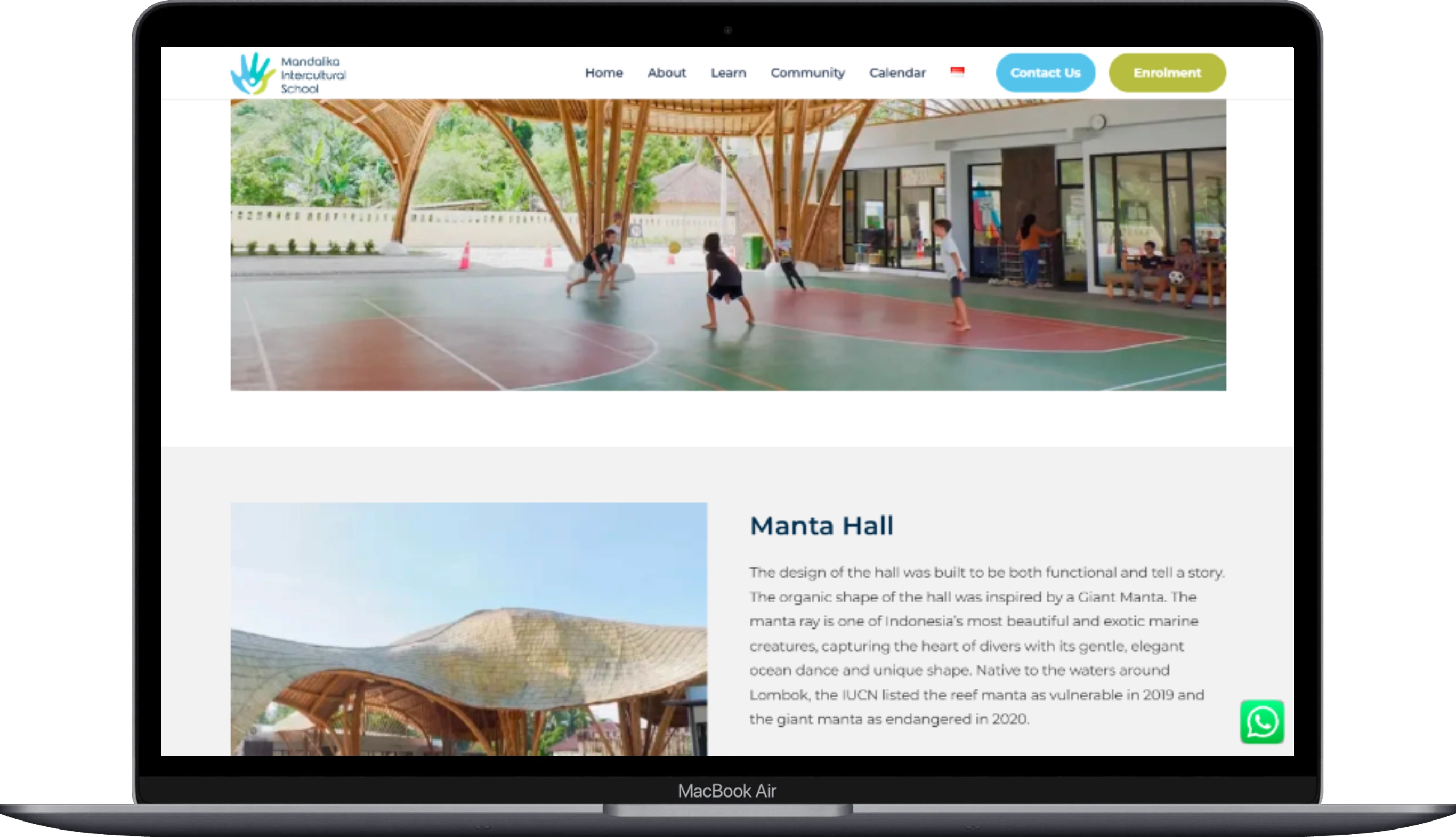 The page of the Mandalika Intercultural School website displayed on a laptop.