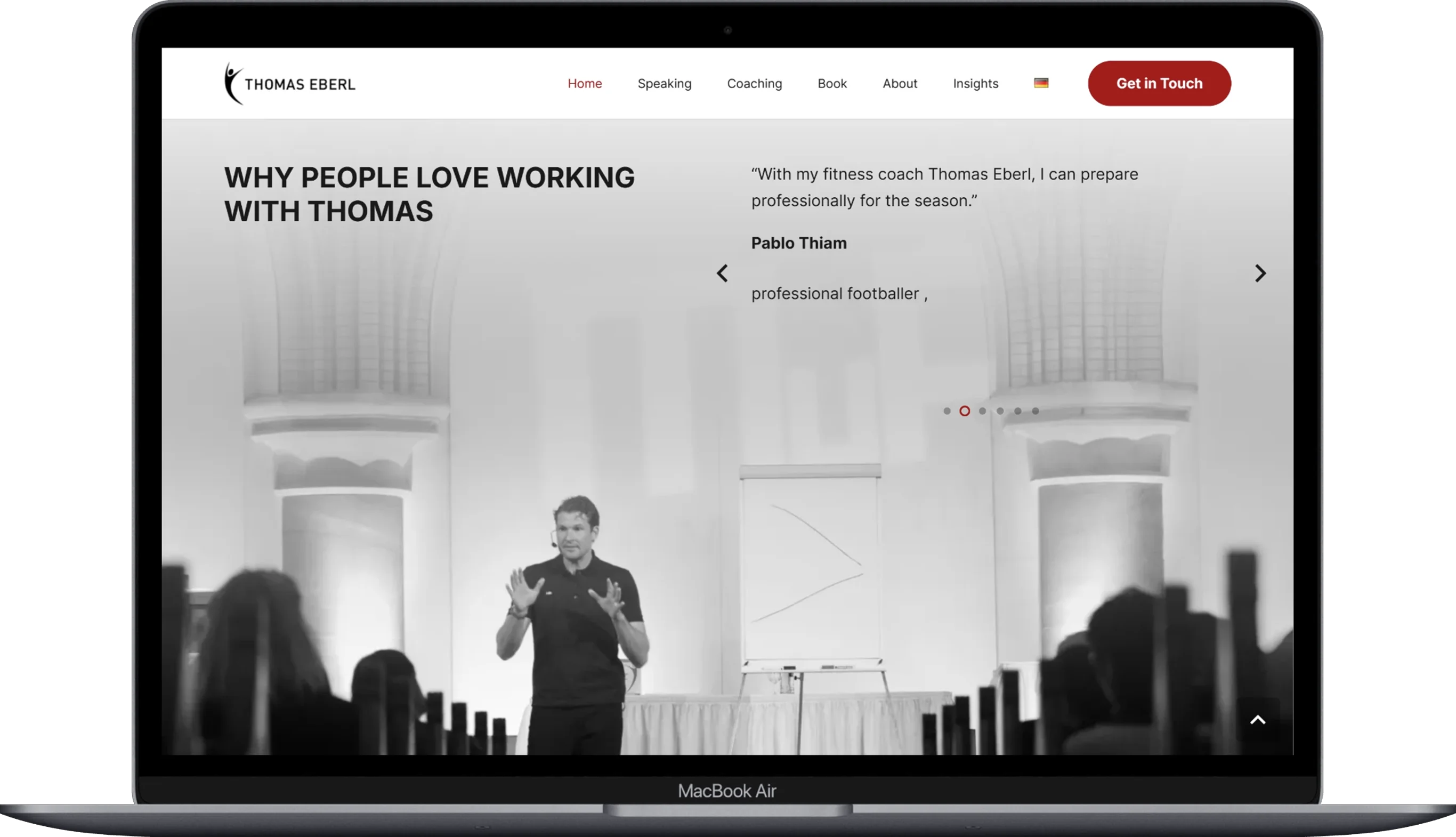 The page of the thomas-eberl website displayed on a laptop.