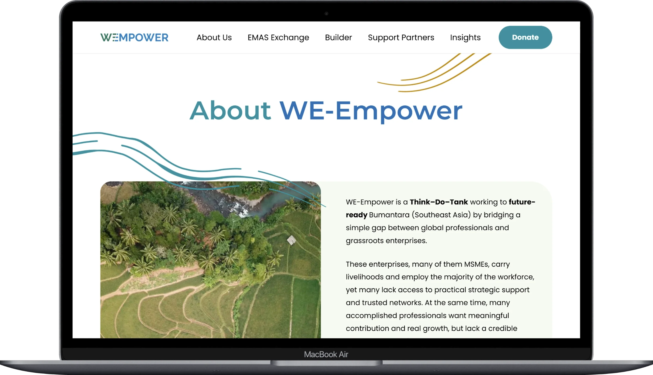 The page of the we-empower website displayed on a laptop.