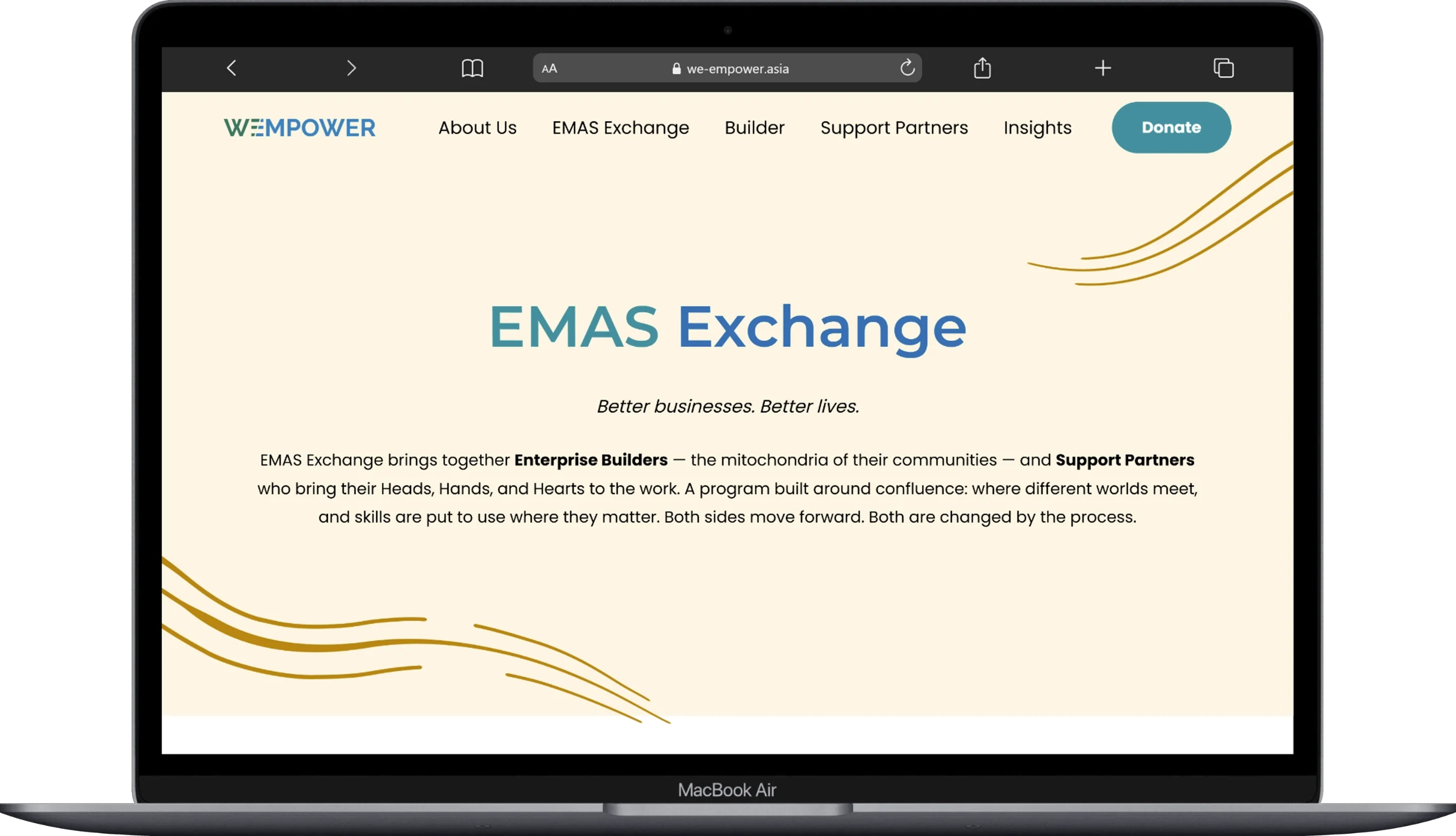 The page of the we-empower website displayed on a laptop.