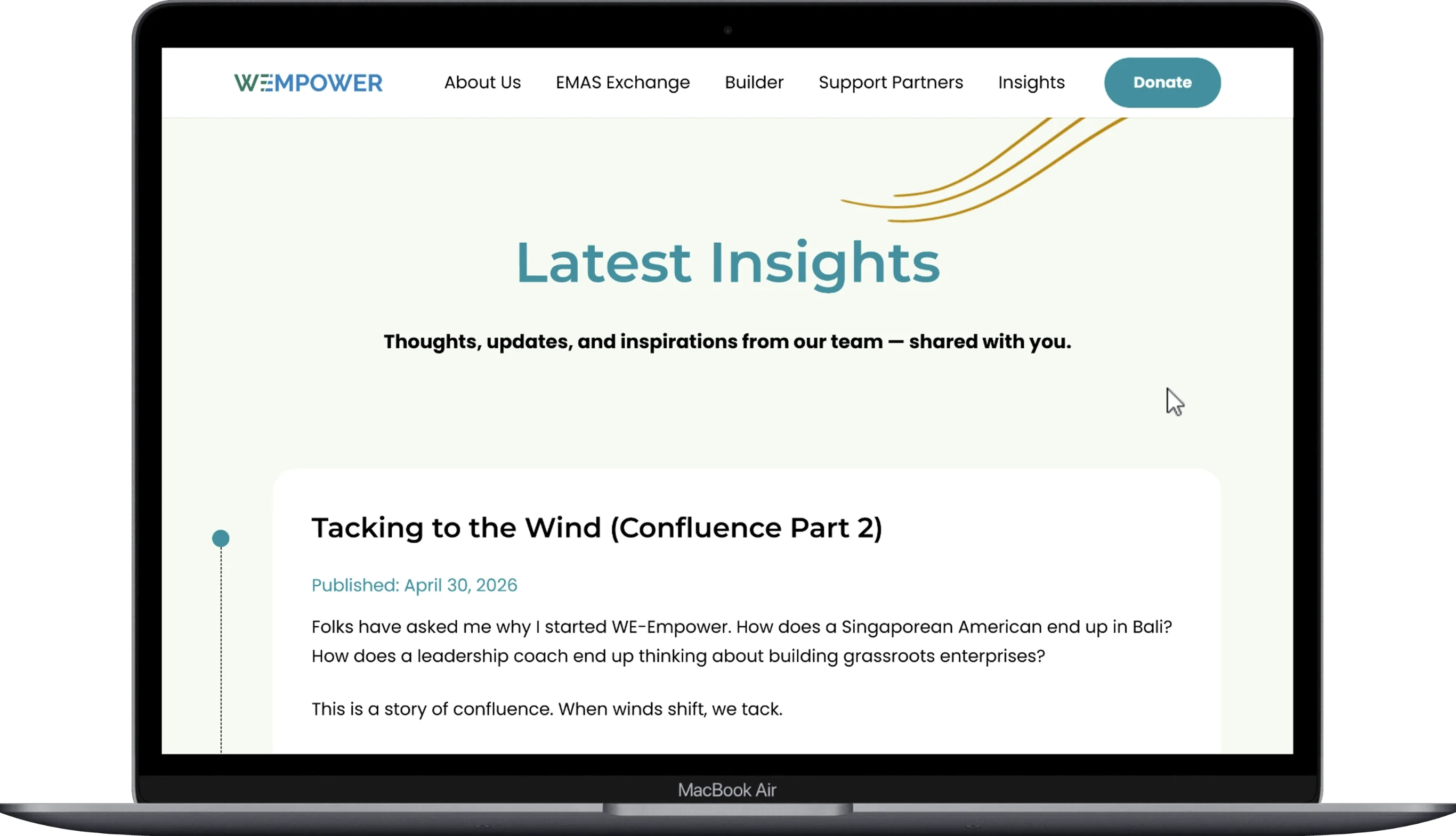 Our Crew page of the we-empower website displayed on a laptop.